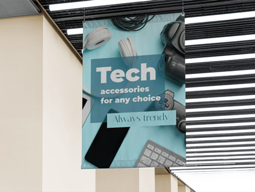 A vinyl banner reading Tech Accessories for Any Choice - Always Trendy, hanging indoors